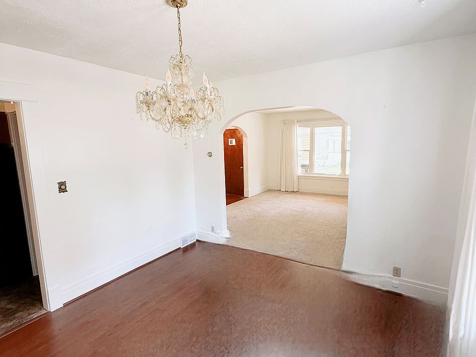 Dinning Room; features premium custom blinds, beautiful chandlier