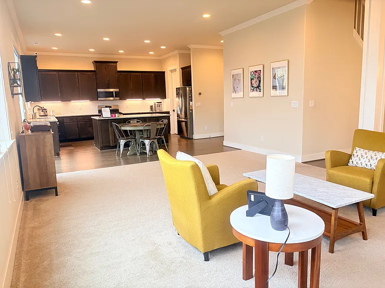 Bright open floor plan connecting living, dining, and kitchen.