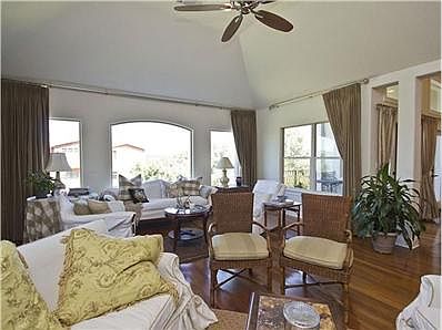 Main/upper level family room w/ lots of windows & fireplace