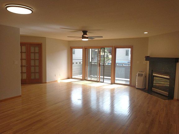 Open Living area with gas fireplace and patio deck