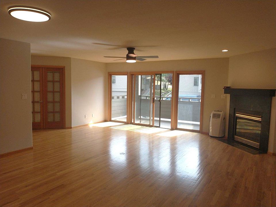 Open Living area with gas fireplace and patio deck