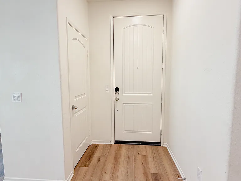 Entry way. Coat closet on the left