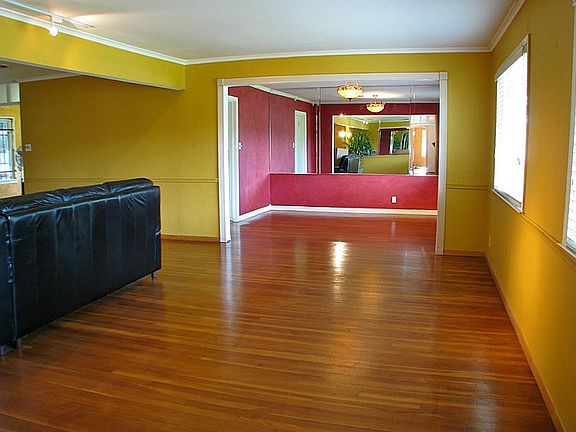 Looking from the entry foyer into the living room and towards the formal dining room.