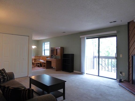 Living room (plus door leading to the porch) and dining room area
