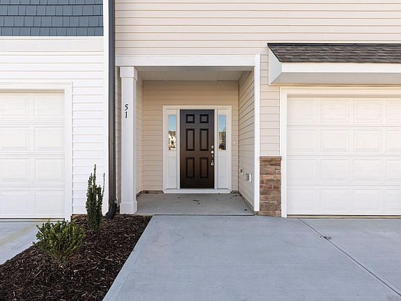 Front door, porch and garage