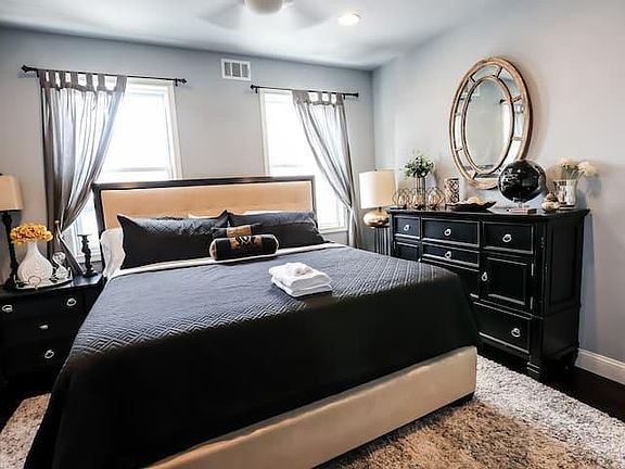 Step into an entire master suite, designed for comfort with the plush king size bed. This master suite features a lux en suite master bath with dual vanity, and double showers. Equipped with a 14-bottle dual zone wine fridge and Keurig coffee/tea bar