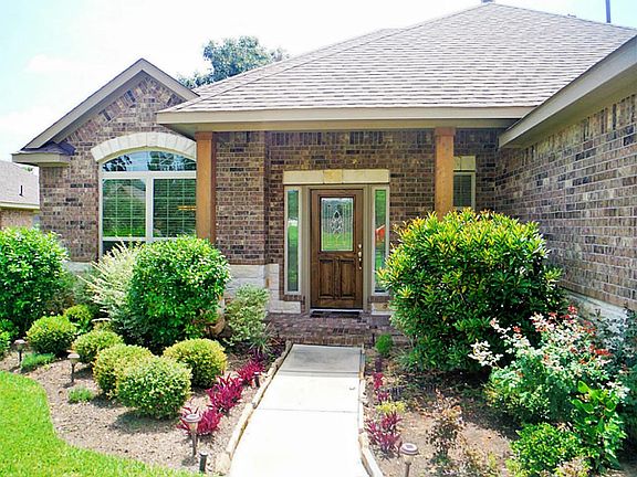Beautiful landscaping that invites you right to the front door.