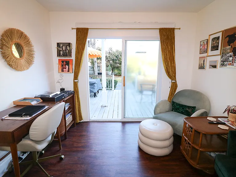 Bonus room opens up to massive back patio through a sliding glass door