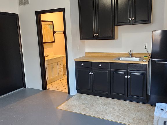 Kitchen with view into the bathroom