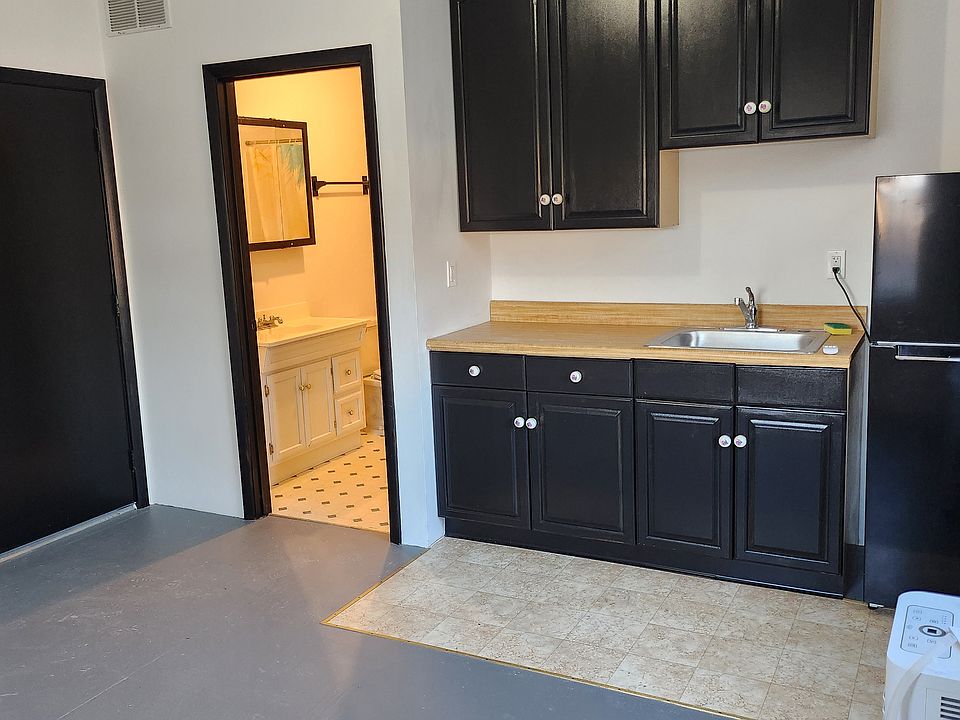 Kitchen with view into the bathroom