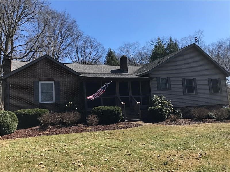 Front exterior with screen porch.