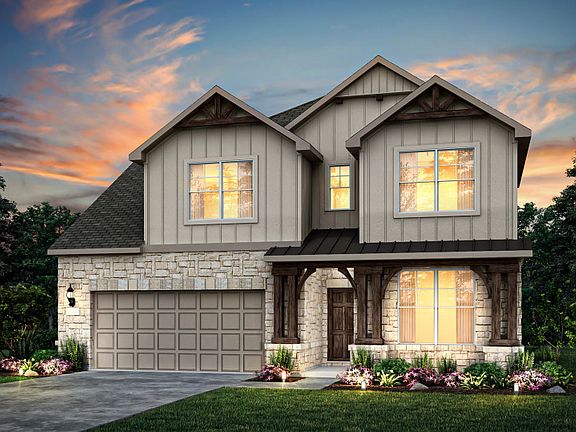 Exterior M with wood shutters, stone accents, and 2-car garage with additional storage