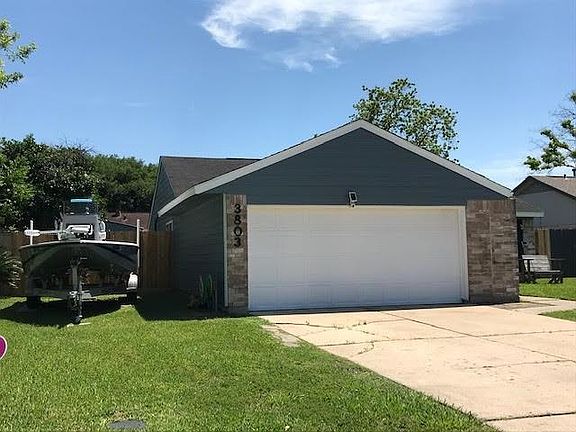 The side yard has enough room for a boat.