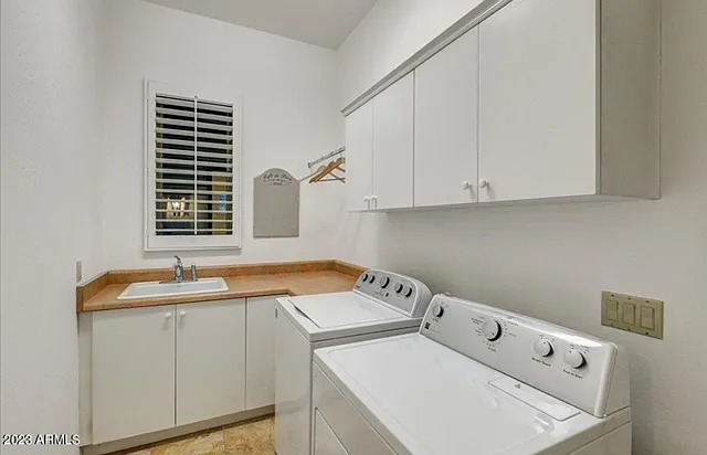 Spacious laundry room with sink