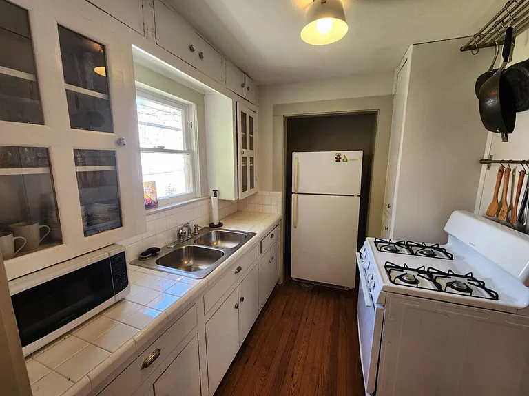 E 11th 1/2 St — Photo 7