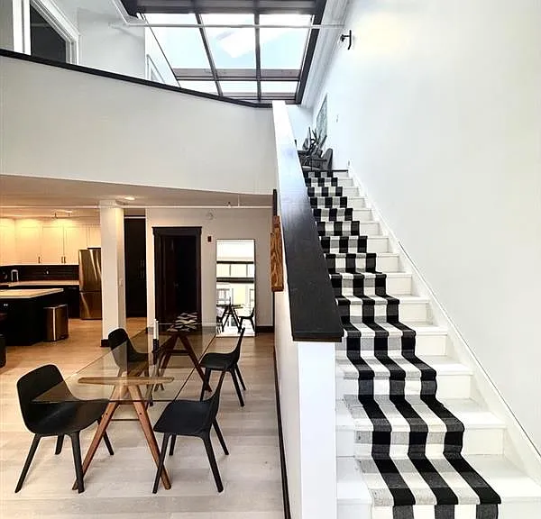 Dining space and stairway to 2nd floor