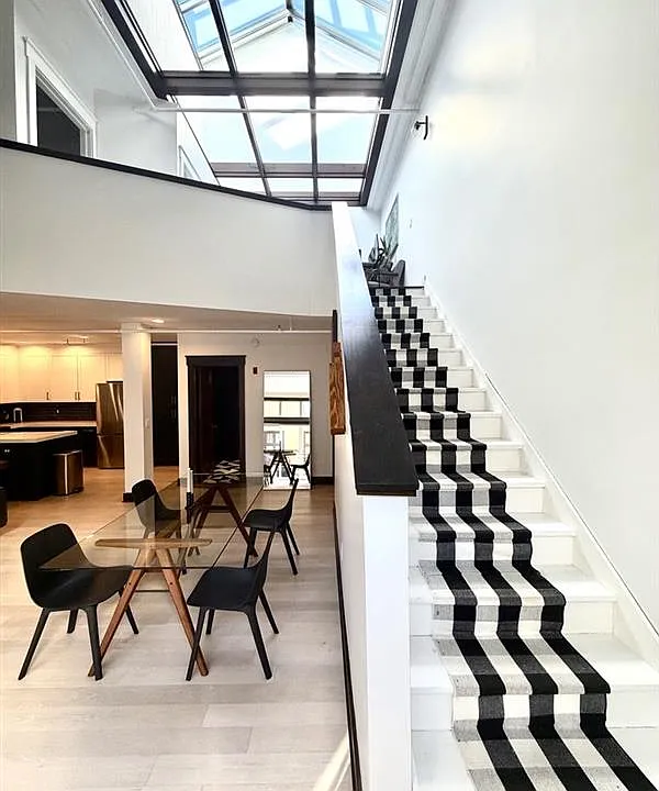Dining space and stairway to 2nd floor