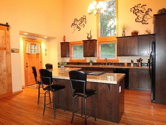 Kitchen has large center island that can accomodate 8 people comfortably. Great for entertaining.
