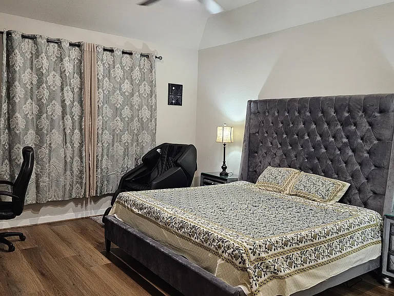 Master bedroom with Jacuzzi bathtub in the attached bathroom