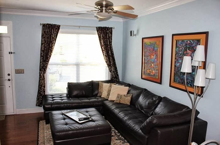 Living Room with surround sound pre-wiring and remote-controlled ceiling fan