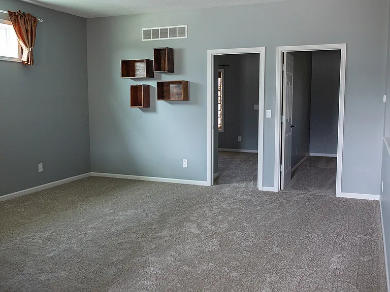 Living Room & Entrance to Primary Bedroom and Second Bedroom