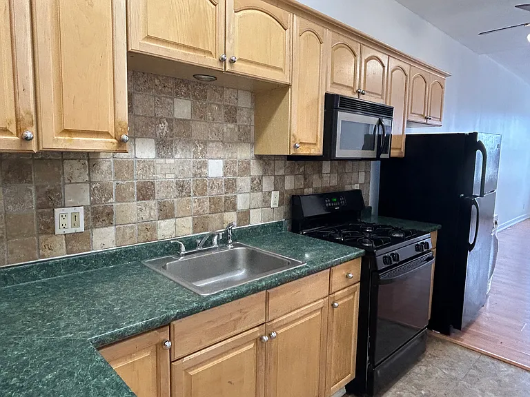kitchen with counter space and backsplash