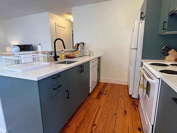 Brand new kitchen cabinets, countertops and sink.
