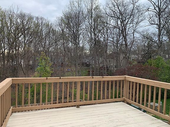 Deck off of the kitchen. Perfect for grilling. This corner lot house backs to woods providing privacy.