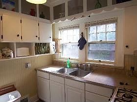 Updated eat-in-kitchen with new cabinets, sink 