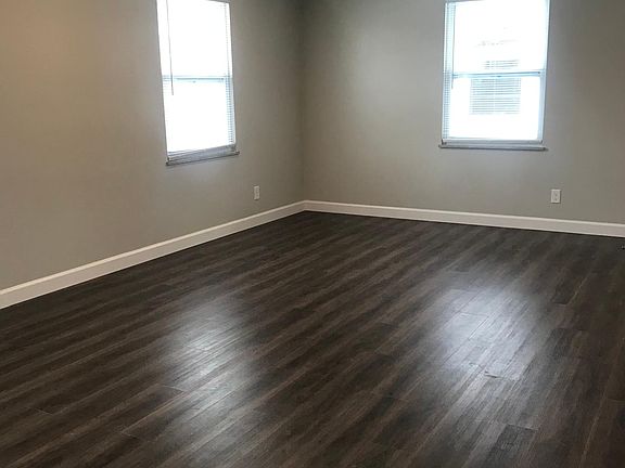 Spacious living room with plenty of light.