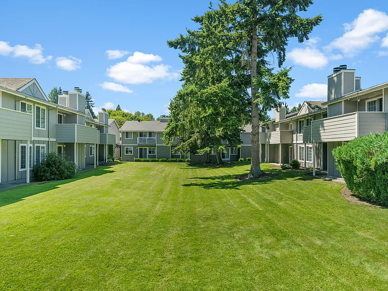Expansive open green spaces with shade trees and peaceful views.