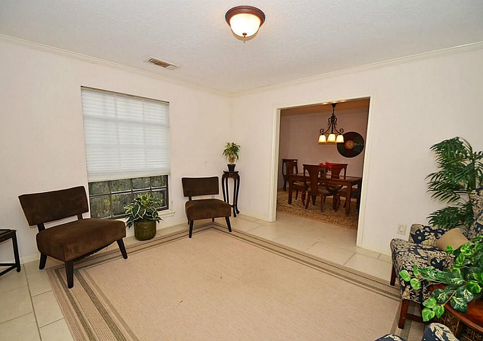 FORMAL SITTING THAT OPENS UP INTO FORMAL DINING ROOM