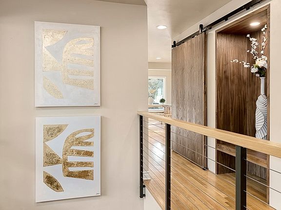 Modern, sleek handrail design staircase.