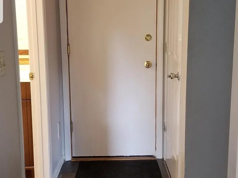 door to the garage. (bathroom is on the left, stairs to the floor above are on the right.