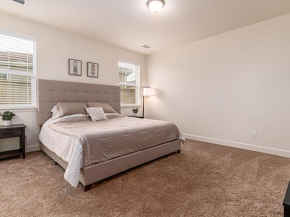 King bed with Roku tv, a 
walk-in closet and walk-in full bathroom with tub