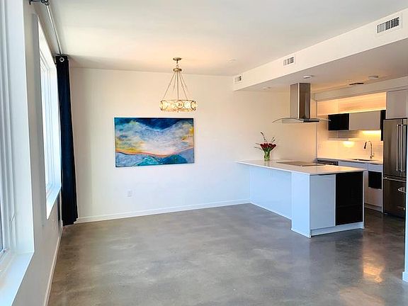 Dining Room / Kitchen. Polished concrete floors.