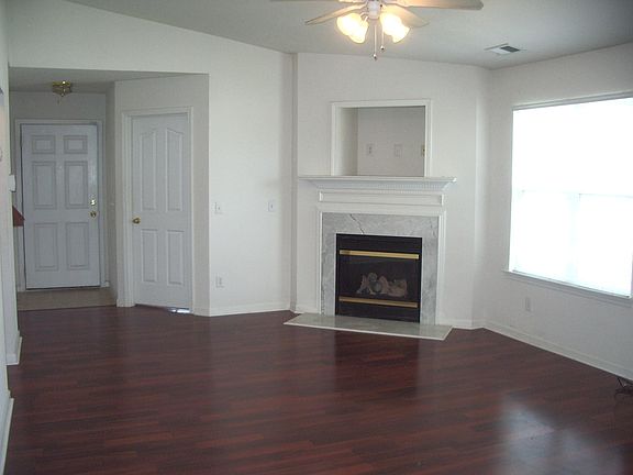 Living / Dining Room with corner fireplace.