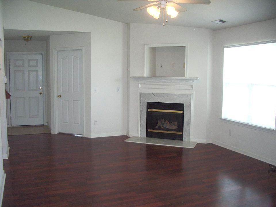 Living / Dining Room with corner fireplace.
