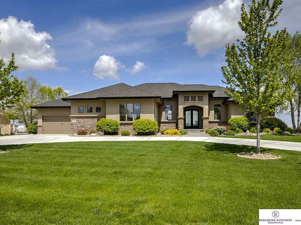 Stone & Stucco Front with True 4+ Car Garage on Quiet 3/4 Acre Cul de Sac Lot with Great Southern Exposure!
