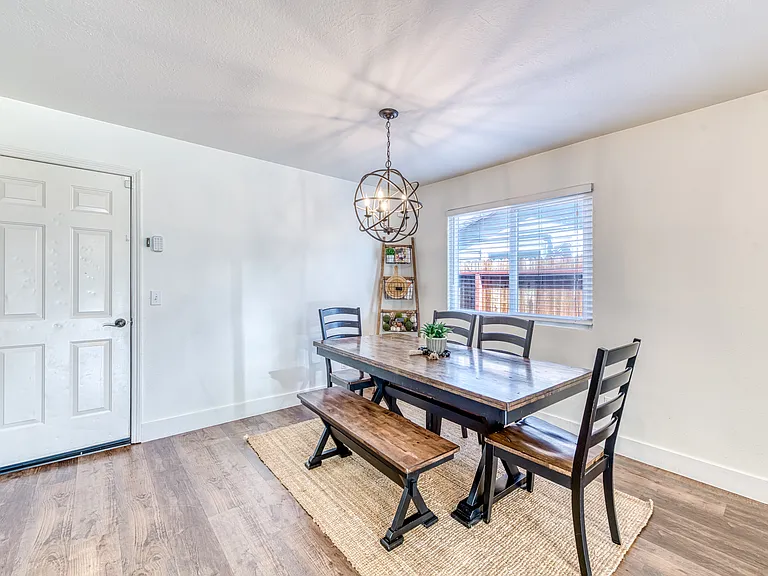 Dining area can accommodate a large table and leads to the attached garage