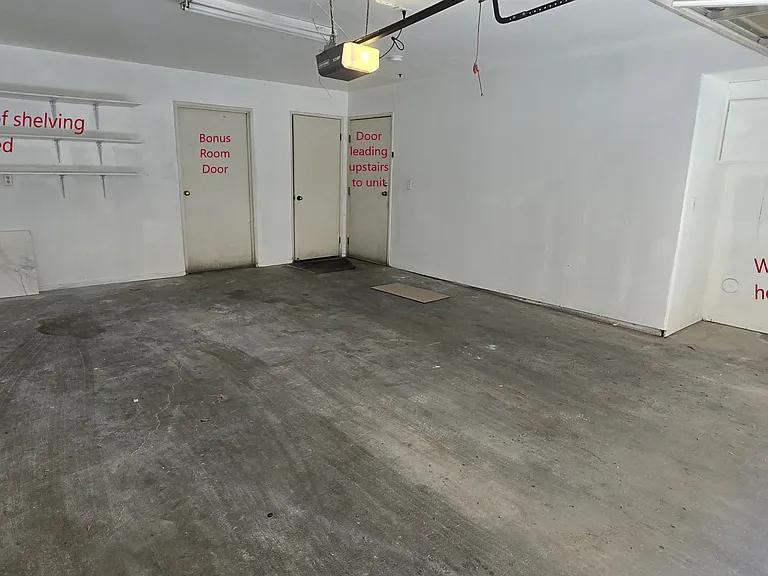 2-car garage with included shelving. Also washer/dryer hookup with storage cabinets above