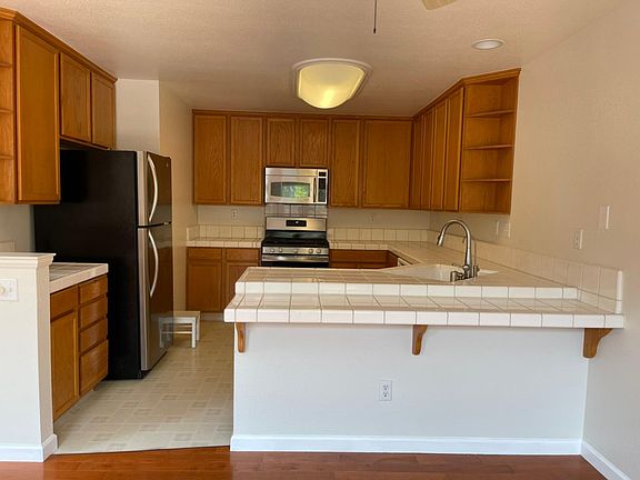 Open Kitchen with a lot of cabinets for storage and brand new gas range