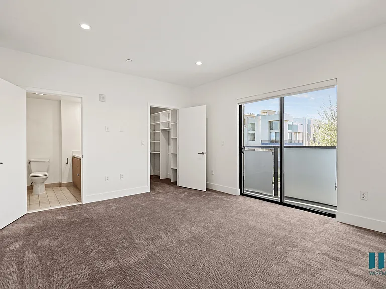 Bedroom with Bathroom, Walk-In Closet, Recessed Lighting, and Balcony