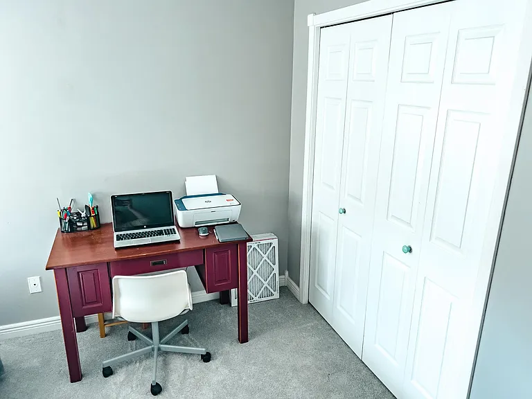 2nd bedroom with room for guest bed and home office.