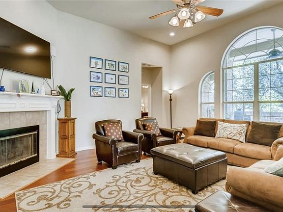 Living Room with high ceilings and large windows.
