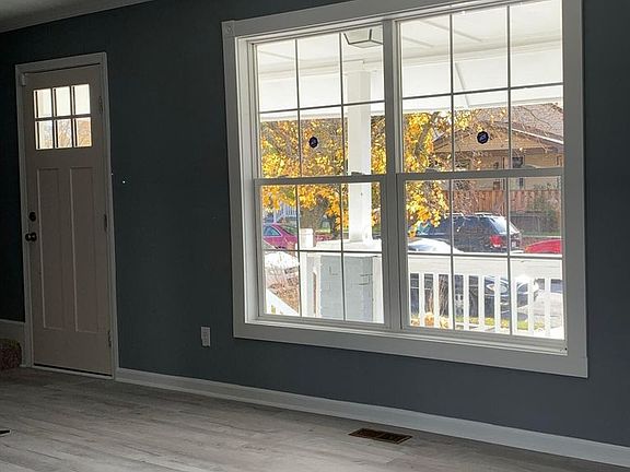 Large front living windows provide natural lighting.