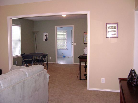 View from the front door; great open space between the living room and dining