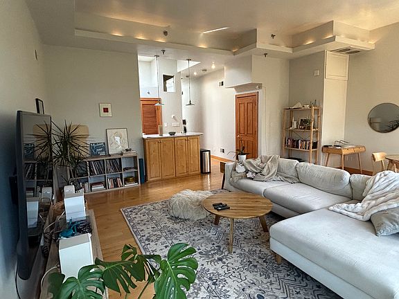 Living room 
High ceilings and hardwood flooring throughout
