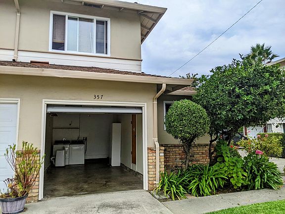 Private garage with opener. Washer and dryer in garage. Garage has shelving and cabinet