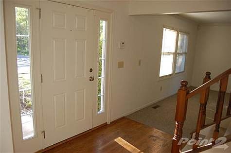 Full side lights brighten the entry.  Hardwood floors welcome your guests.
